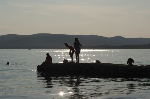 Girls Silhouettes On The Beach