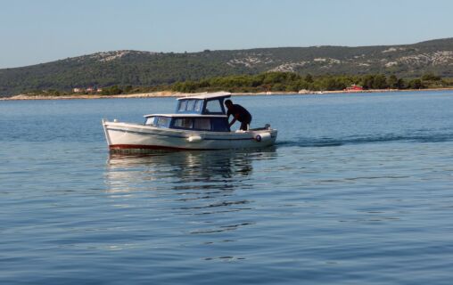 Small Boat At Sea