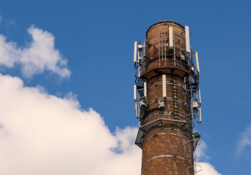 Old brick chimney with mobile phone antennas