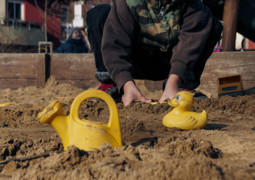 Young boy in the sandbox
