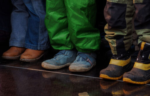 Three children standing – shoes and feet
