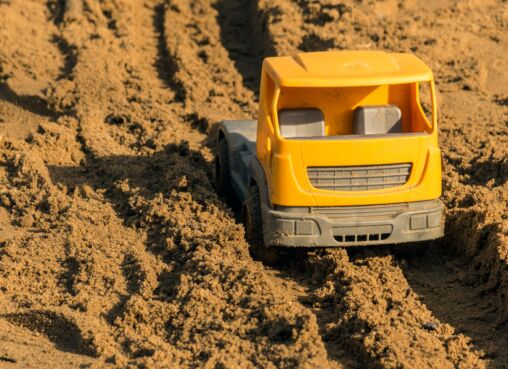 Plastic toy car on the playground