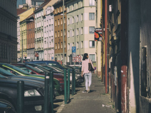 Girl walking on the street of Prague