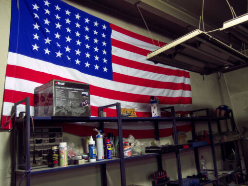 American Flag On The Wall Of Car Repair Shop