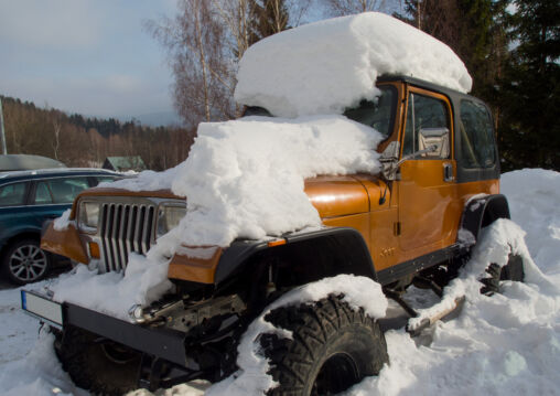 Off Road Jeep Car Covered With Snow