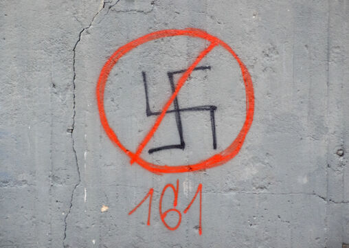Crossed-Out Swastika On A Wall