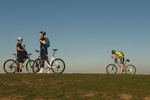 Three Bikers On The Top The Hill