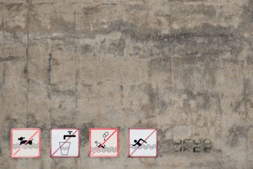 Signs prohibiting bathing dogs, swimming and drinking