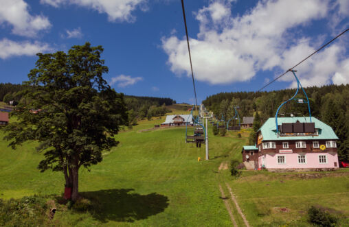 Chair Lift Above The Green Meadow