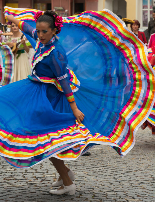 Dancing woman in traditional mexican dress