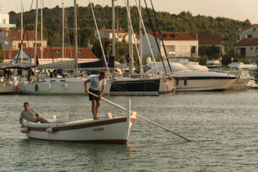 Two Men on Wooden Boat in Croatia