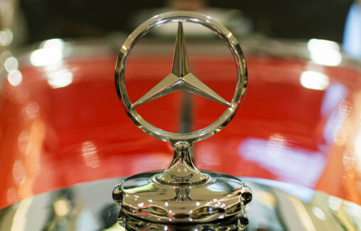 The Mercedes-Benz logo on a classic car