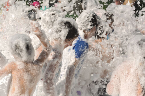 Children Playing in Firefighter Foam