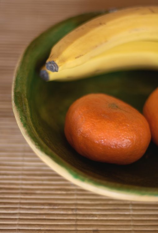 Still life with fruits in ceramic bowl