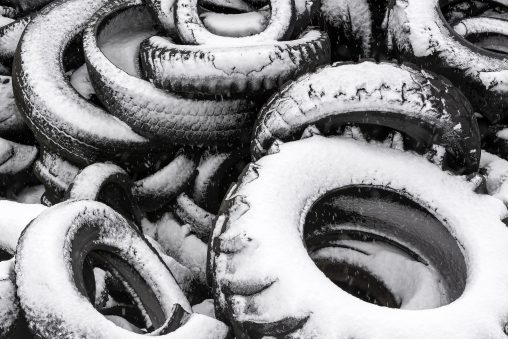 Pile of Old Tires Covered with Snow